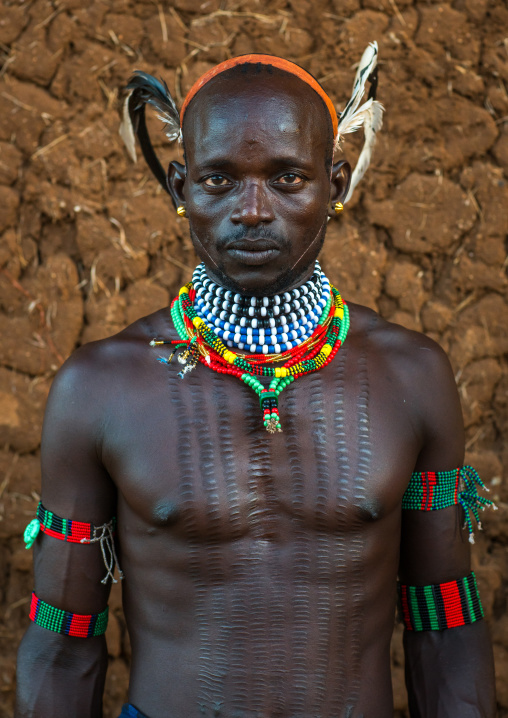 Maze whipper with scarifications on the chest to indicate he killed a man, Omo valley, Turmi, Ethiopia