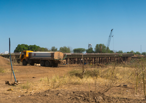 Metal bridge being built by chinese workers above omo river, Omo valley, Kangate, Ethiopia