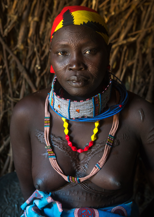 Toposa tribe woman with scarified face, Omo valley, Kangate, Ethiopia