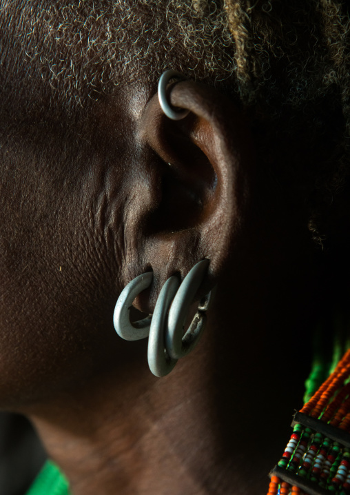 Close up of toposa tribe woman earrings, Omo valley, Kangate, Ethiopia