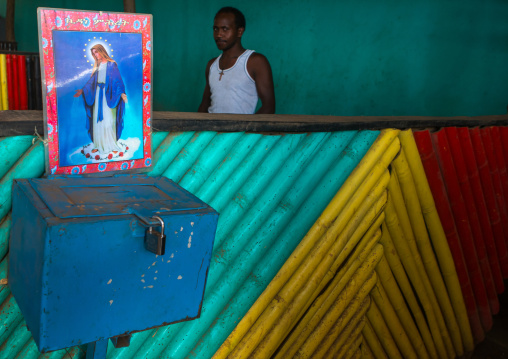 Donation box with virgin maria poster on it in a bar, Omo valley, Kangate, Ethiopia