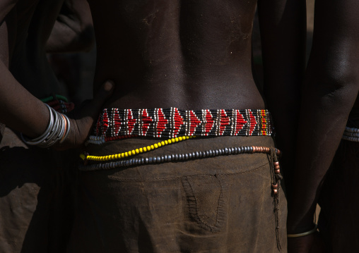 Nyangatom tribe woman with a beaded belt, Omo valley, Kangate, Ethiopia