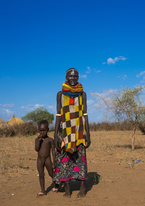 Murle tribe woman with a beaded apron and her child, Omo valley, Kangate, Ethiopia