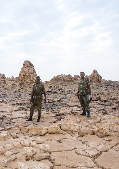 Ethiopian soldiers in front of volcanic formations in the danakil depression, Afar region, Dallol, Ethiopia