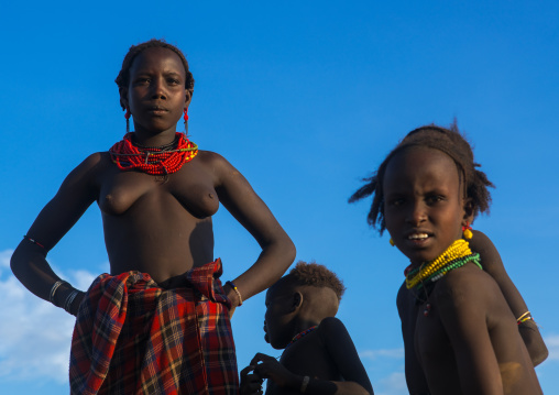 Topless dassanech tribe woman and children, Omo valley, Omorate, Ethiopia