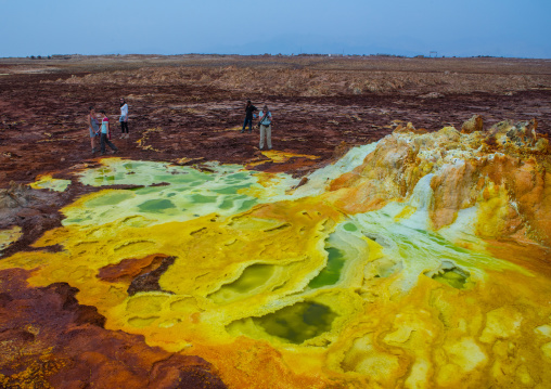 Tourists in the colorful volcanic landscape of dallol in the danakil depression, Afar region, Dallol, Ethiopia