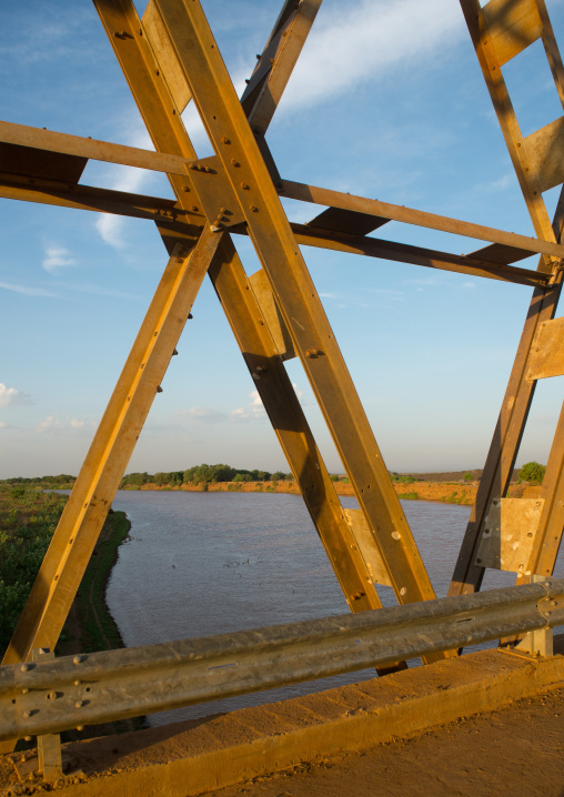 Metal bridge being built by chinese workers above omo river, Omo valley, Omorate, Ethiopia