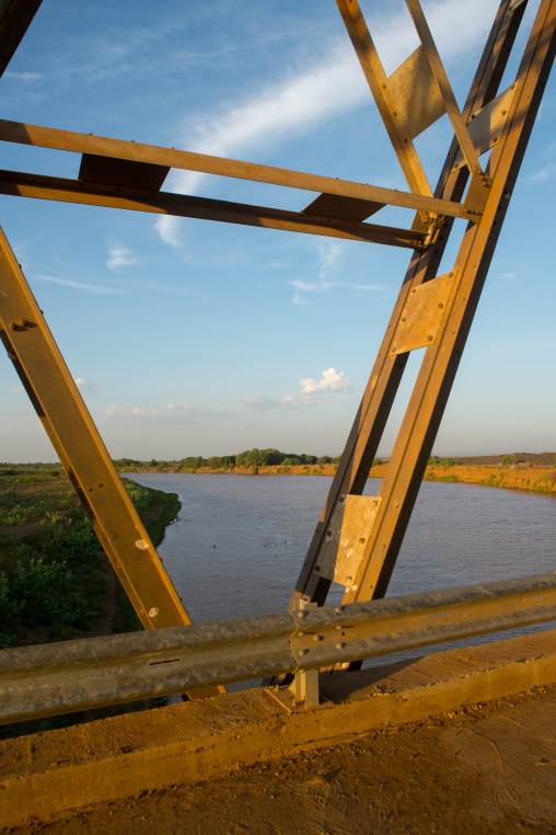 Metal bridge being built by chinese workers above omo river, Omo valley, Omorate, Ethiopia