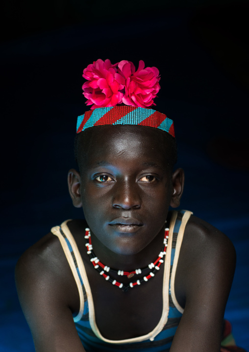 Portrait of a bana tribe man with red plastic flower in the hair, Omo valley, Key afer, Ethiopia