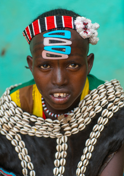 Portrait of a tsemay tribe girl with traditional goat skin clothes, Omo valley, Key afer, Ethiopia