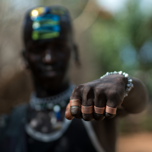 Tsemay tribe man showing his hand and his rings, Omo valley, Key afer, Ethiopia