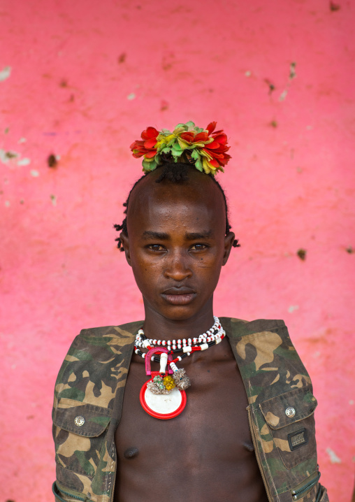 Portrait of a bana tribe man with plastic flowers in the hair, Omo valley, Key afer, Ethiopia