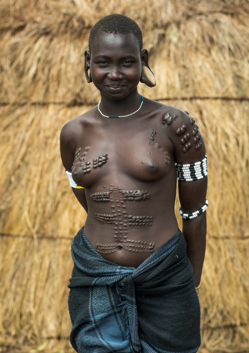 Mursi tribe woman with breast scarifications, Omo valley, Mago park, Ethiopia