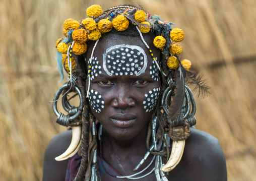 Mursi tribe woman with adornments and tribal make up, Omo valley, Mago park, Ethiopia