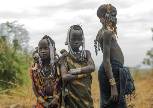 Mursi tribe children with adornments on the heads, Omo valley, Mago park, Ethiopia