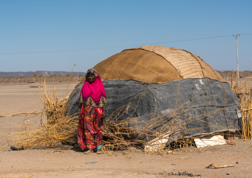 Afar tribe woman in front of her traditional hut, Afar region, Semera, Ethiopia