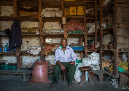 Coffee merchand inside his shop, Omo valley, Jinka, Ethiopia