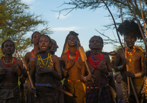 Dassanech tribe women and man during the dimi ceremony to celebrate the circumcision of the teenagers, Omo valley, Omorate, Ethiopia