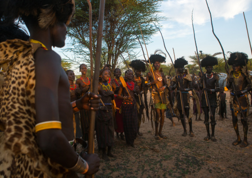 Dassanech men and women during dimi ceremony to celebrate circumcision of teenagers, Omo valley, Omorate, Ethiopia