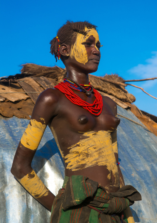 Dassanech tribe teenage girl during dimi ceremony to celebrate circumcision of teenagers, Omo valley, Omorate, Ethiopia