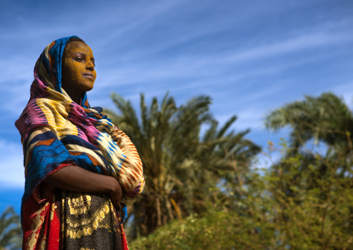 Afar tribe teenage girl with qasil on her face, Afar region, Afambo, Ethiopia