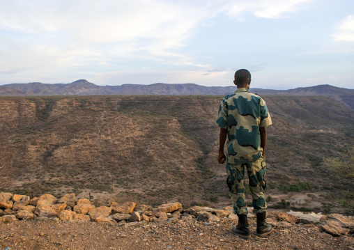 Ethiopian soldier looking the valley, Afar region, Awash, Ethiopia