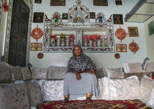 Ethiopian woman inside her decorated harari house, Harari region, Harar, Ethiopia