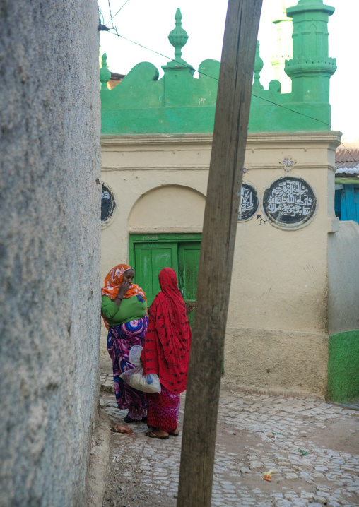 Women chatting in front of a mosque in the streets of the old town, Harari region, Harar, Ethiopia
