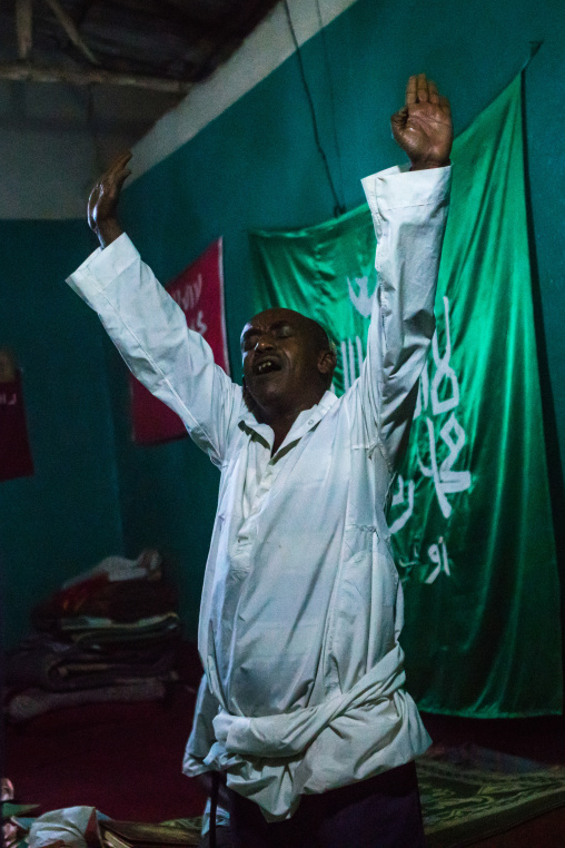 Sufi man goes into a trance during a ceremony, Harari region, Harar, Ethiopia