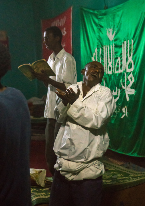 Sufi people go into a trance during a ceremony, Harari region, Harar, Ethiopia