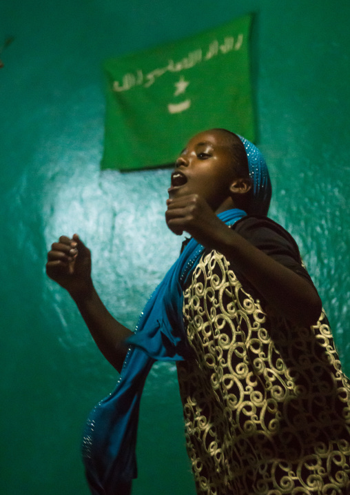 Sufi teenage girl goes into a trance during a ceremony, Harari region, Harar, Ethiopia