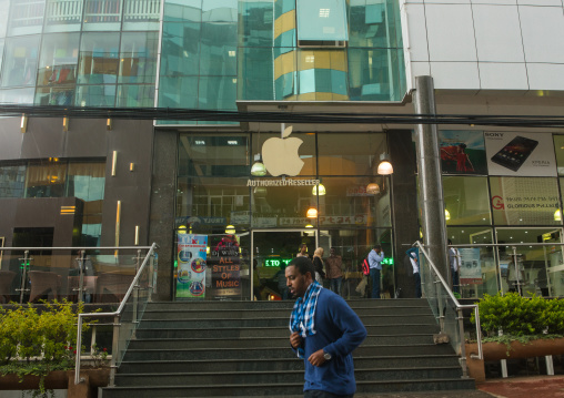 Man passing in front of a mall with iphone shop, Addis abeba region, Addis ababa, Ethiopia