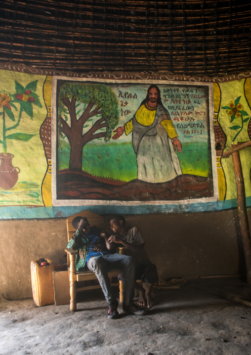 Ethiopia, Kembata, Alaba Kuito, ethiopian children inside their traditional house with decorated and painted walls
