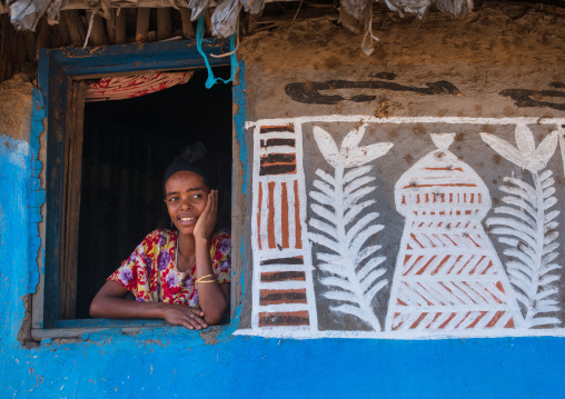 Ethiopia, Kembata, Alaba Kuito, ethiopian woman standing at the window of her traditional painted house