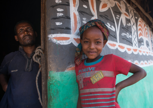 Ethiopia, Kembata, Alaba Kuito, father and daiughter standing in front of a traditional painted house
