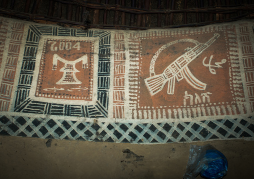 Ethiopia, Kembata, Alaba Kuito, headrest and kalashnikov on a painted house