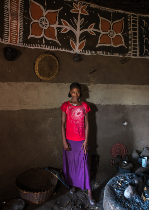 Ethiopia, Kembata, Alaba Kuito, ethiopian teenage girl inside her traditional painted and decorated house