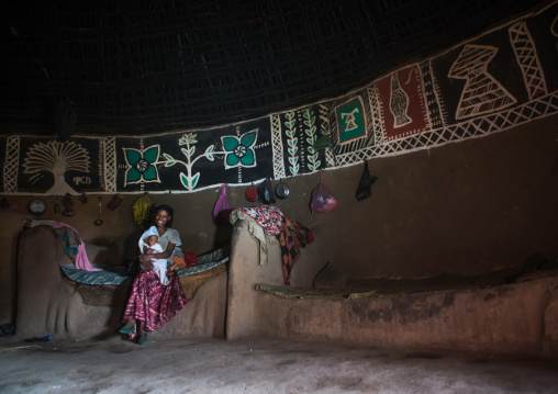 Ethiopia, Kembata, Alaba Kuito, ethiopian woman inside her traditional painted and decorated house