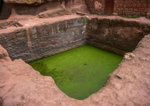 Monolithic rock-cut church pool for timkat, Amhara region, Lalibela, Ethiopia