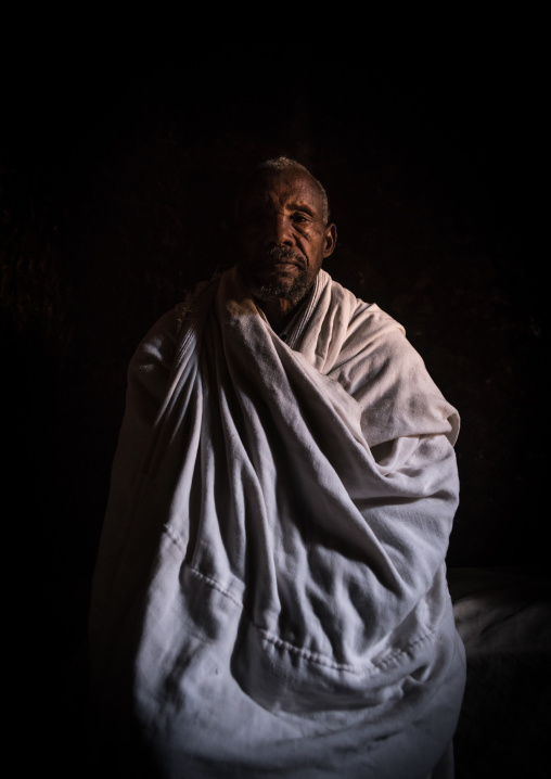 Portrait of a man inside a rock church, Amhara region, Lalibela, Ethiopia