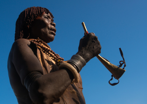 Hamer tribe woman attending a bull jumping ceremony, Omo valley, Turmi, Ethiopia