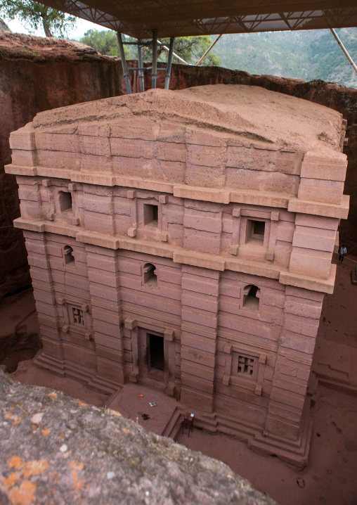 Protective shelters over bete amanuel monolithic rock-cut church, Amhara region, Lalibela, Ethiopia