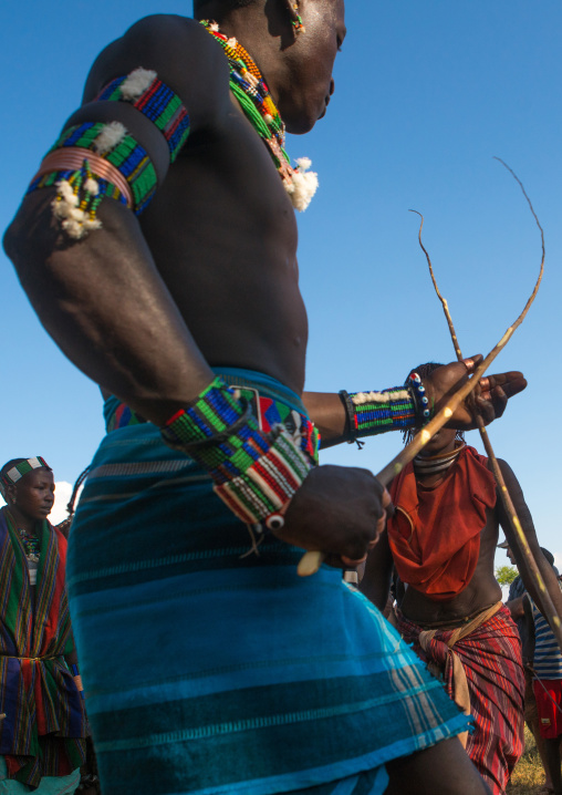 Hamer tribe maze whipping a woman during a bull jumping ceremony, Omo valley, Turmi, Ethiopia