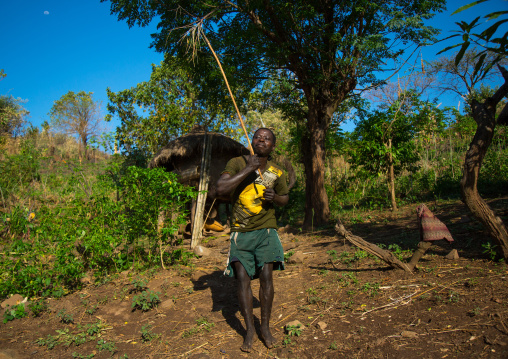 Dime tribe man dancing with a stick, Omo valley, Hana mursi, Ethiopia