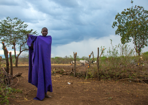 Bodi tribe woman with a purple loin cloth, Omo valley, Hana mursi, Ethiopia
