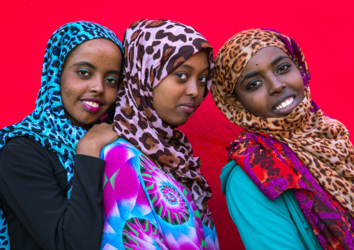 Three smiling veiled harari sisters, Harari Region, Harar, Ethiopia