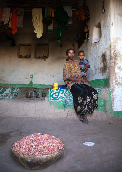 Mother and child inside their traditional Argoba stone house, Harari Region, Koremi, Ethiopia