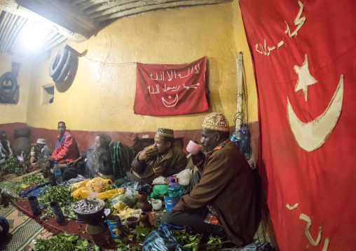 Ethiopian people chewing khat during a sufi ceremony lead by Amir Redwan in Ummi Tahir Nabigar, Harari Region, Harar, Ethiopia