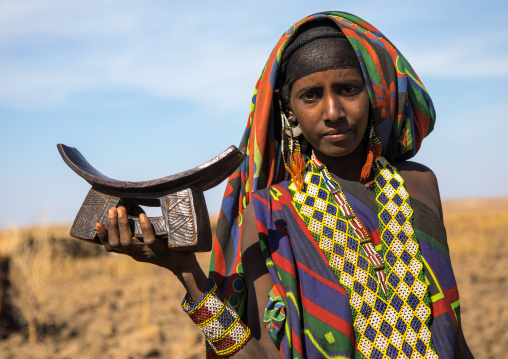 Issa tribe woman with a wooden pillow, Afar region, Yangudi Rassa National Park, Ethiopia