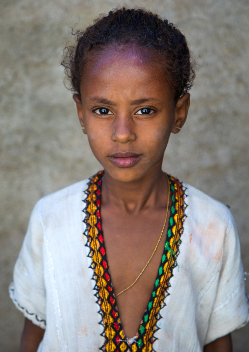 Portrait of an ethiopian child girl in traditional clothing, Afar region, Assaita, Ethiopia